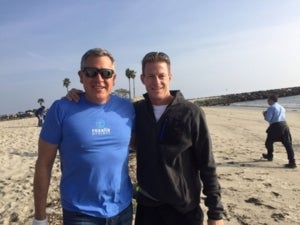 Steve Russell on the Beach with Doug during a beach cleanup